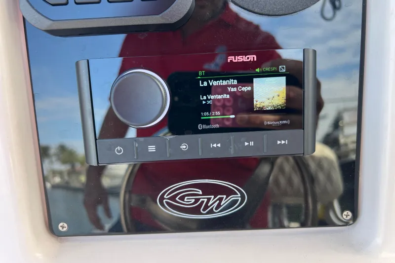 Slide: The Image of Fusion stereo system on 1999 Grady-White Escape 209 boat dashboard. - 32