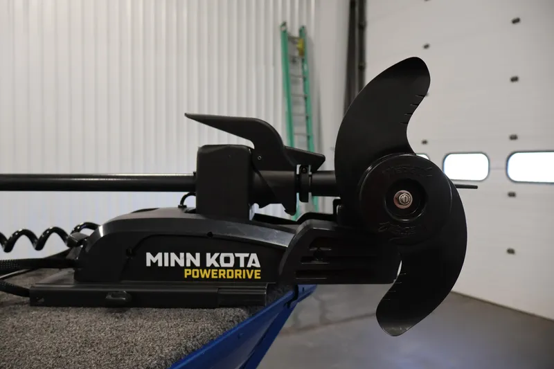 Slide: The Image of Minn Kota PowerDrive motor on 2021 Lund 1650 Angler Sport boat in garage. - 13