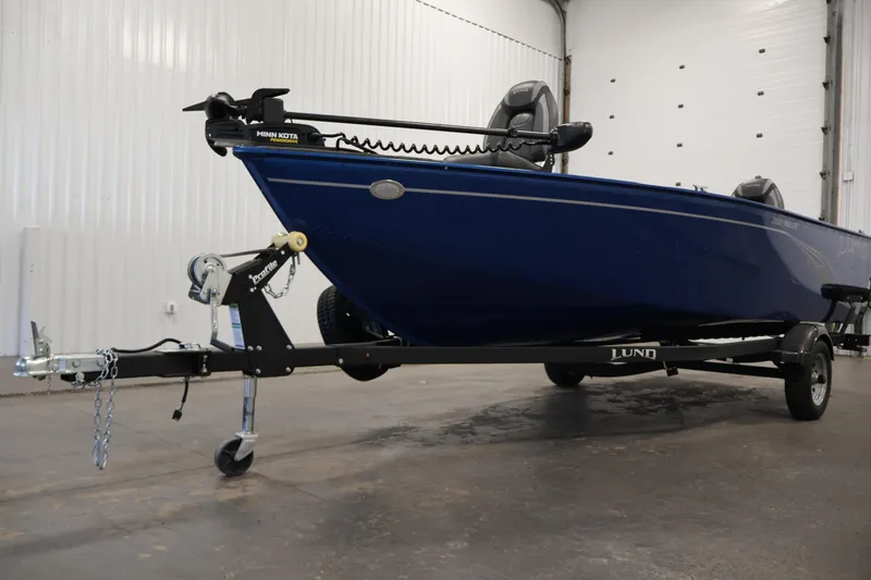 Slide: The Image of 2021 Lund 1650 Angler Sport boat on trailer in indoor setting. - 31
