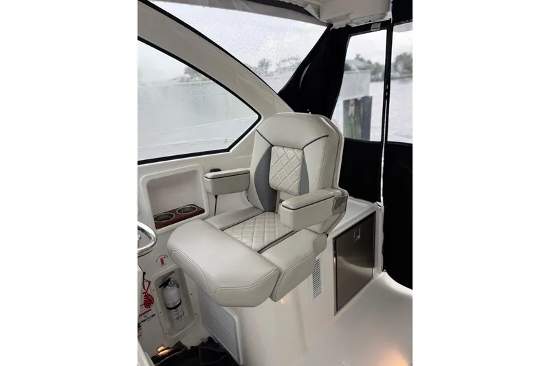 Slide: The Image of Luxurious helm seat in 2025 Pursuit OS 325 Offshore boat interior. - 40