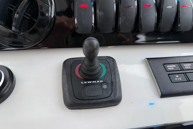 Slide: The Image of Control panel of 2025 Pursuit OS 325 Offshore boat with Lewmar joystick. - 49