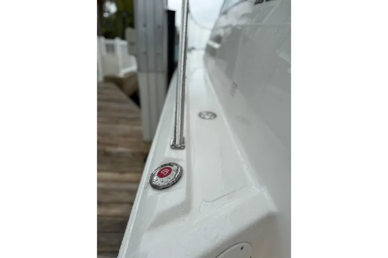 Slide: The Image of 2025 Pursuit OS 325 Offshore boat deck with sleek design and metallic accents. - 88