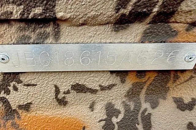 Slide: The Image of Metallic identification plate on camouflaged Xpress X18DB, 2026 model. - 10