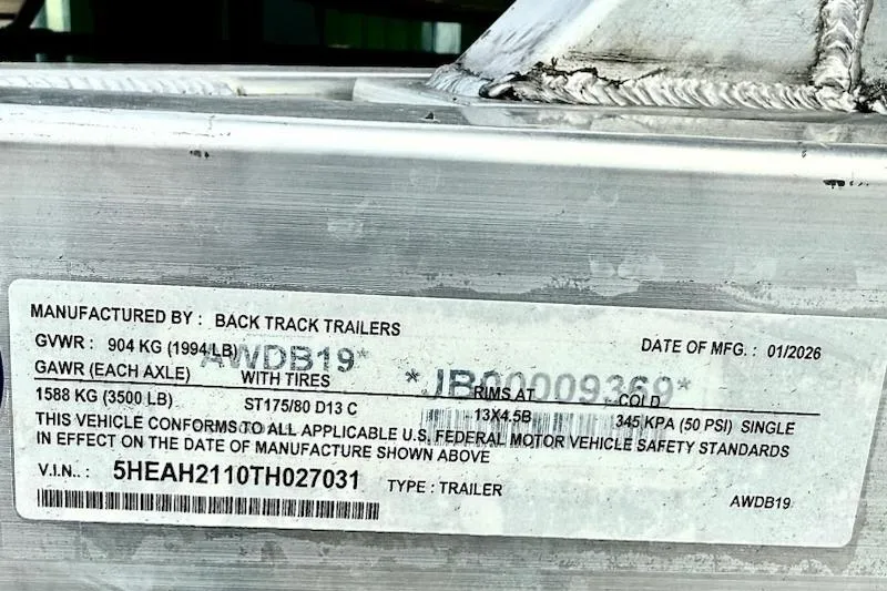 Slide: The Image of Trailer label showing specifications and compliance details, manufactured by Back Track Trailers in 2026. - 12