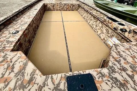 Slide: The Image of 2026 Xpress X18DB boat interior with camouflage design and spacious deck. - 3