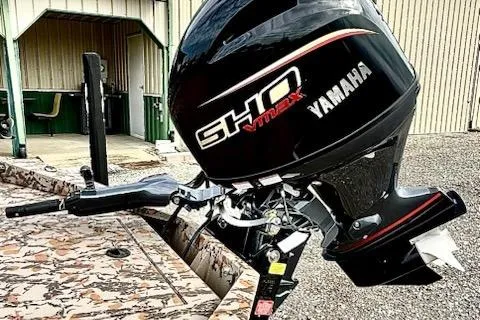 Slide: The Image of 2026 Xpress X18DB boat with Yamaha SHO VMAX outboard motor, parked outdoors. - 7