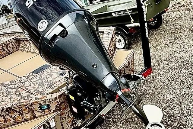 Slide: The Image of 2026 Xpress X18DB boat with camouflage design and powerful outboard motor. - 8