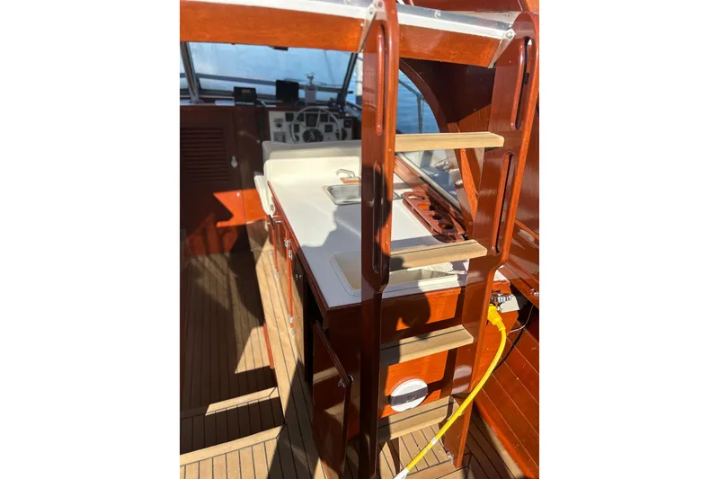 Slide: The Image of 1986 Skiff Craft Sport Fisherman interior with wooden ladder and cockpit view. - 7