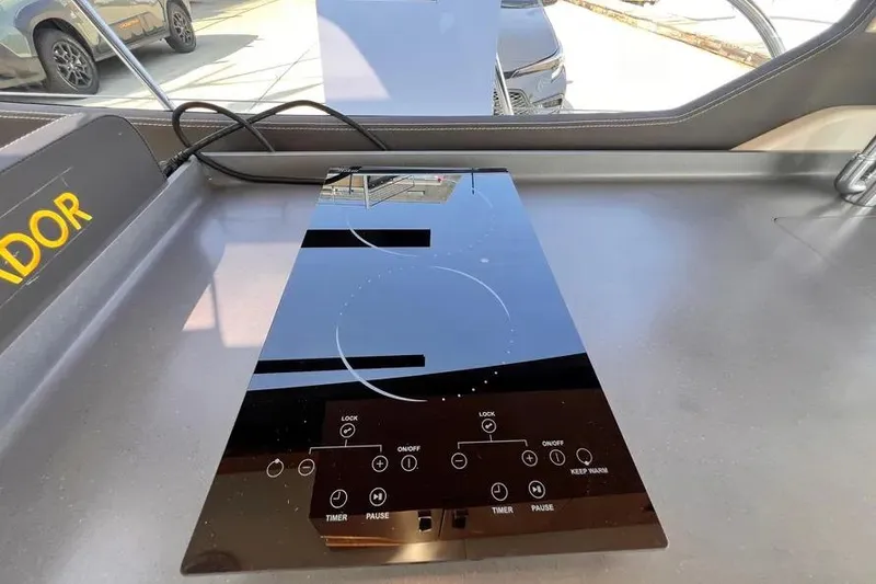 Slide: The Image of Modern Pescador 35 boat kitchen with sleek induction cooktop, 2023 model. - 16