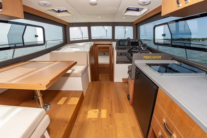 Slide: The Image of Interior of 2023 Pescador 35 boat with modern design and wooden flooring. - 18