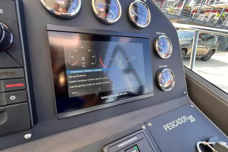 Slide: The Image of Control panel of 2023 Pescador 35 boat with digital display and gauges. - 29