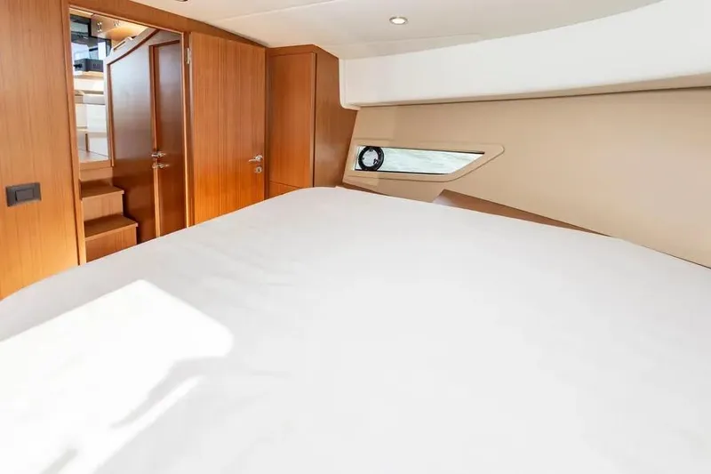 Slide: The Image of Interior of 2023 Pescador 35 yacht with wooden finishes and cozy bed. - 38