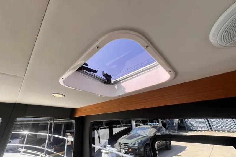 Slide: The Image of 2023 Pescador 35 interior with skylight, showcasing modern design and natural lighting. - 42