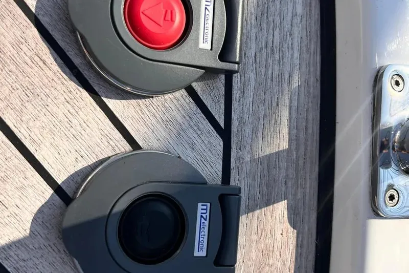 Slide: The Image of Pescador 35 boat switches on wooden deck, 2023 model. - 44