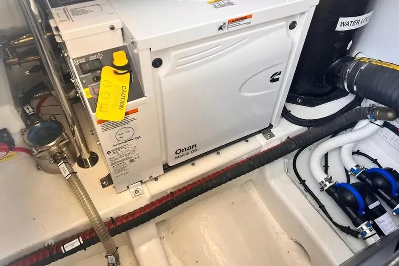 Slide: The Image of Engine room of 2023 Pescador 35 with Onan Marine generator and labeled components. - 47