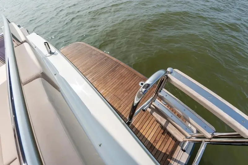 Slide: The Image of Luxury Pescador 35 yacht deck, 2023 model, with wooden finish and stainless steel railings. - 8