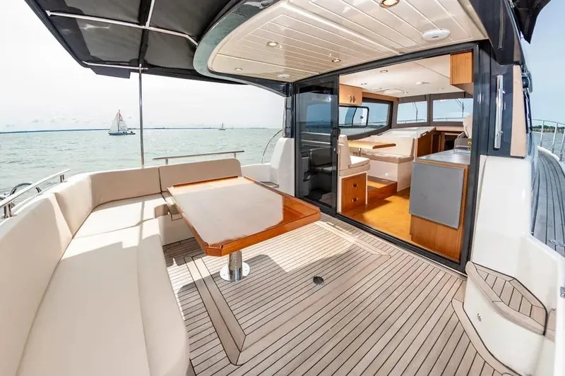 Slide: The Image of Luxurious 2023 Pescador 35 yacht interior with elegant seating and ocean view. - 9