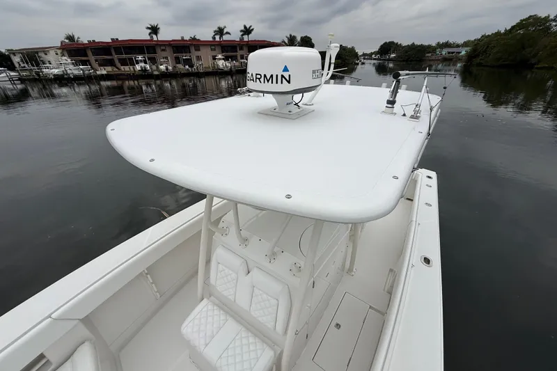 Slide: The Image of 2009 Jupiter 29 boat with Garmin radar on calm water, overcast sky. - 17