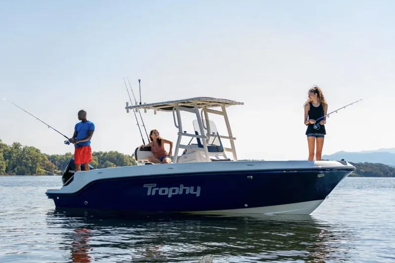 Slide: The Image of Manufacturer Provided Image: 2025 Bayliner Trophy T22CC boat with people fishing on calm water. - 3
