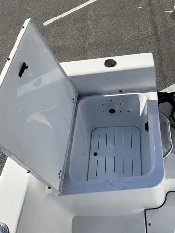 Slide: The Image of Open storage compartment on a 2018 Sportsman 19 Island Reef boat. - 11