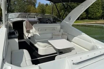 Slide: The Image of Interior of a 2004 Regal Commodore 3260 yacht with white seating. - 1