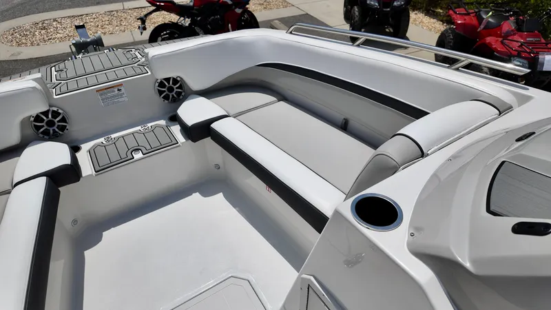 Slide: The Image of 2026 Starcraft SVX 191 OB boat interior with seating and cup holders. - 16