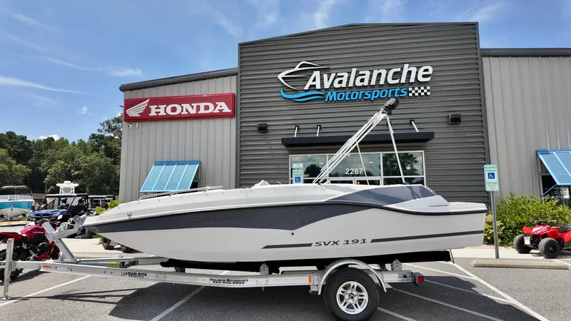 The Image of 2026 Starcraft SVX 191 OB boat on trailer at Avalanche Motorsports dealership. - 2