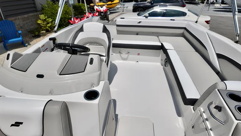 Slide: The Image of 2026 Starcraft SVX 191 OB boat interior with modern seating and steering wheel. - 9