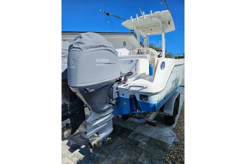 Slide: The Image of 2017 Robalo R242 Center Console boat with Yamaha outboard motor on trailer. - 16