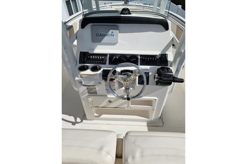 Slide: The Image of 2017 Robalo R242 Center Console boat dashboard with Garmin navigation system. - 24