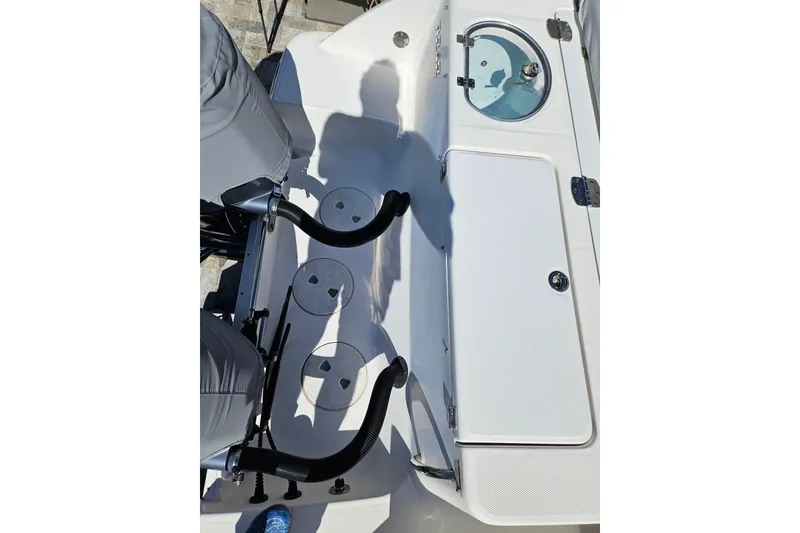 Slide: The Image of 2017 Robalo R242 Center Console boat interior with seating and storage compartments. - 26