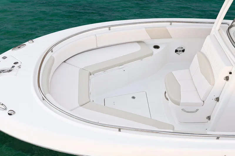 Slide: The Image of Manufacturer Provided Image: 2017 Robalo R242 Center Console boat with white seating and spacious deck. - 3