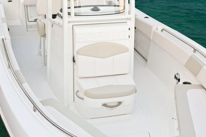 Slide: The Image of Manufacturer Provided Image: 2017 Robalo R242 Center Console boat interior with seating and storage. - 4