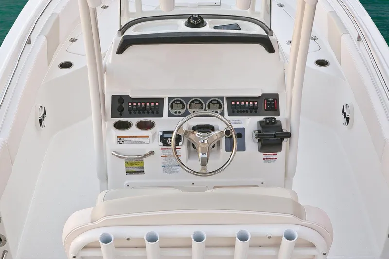 Slide: The Image of Manufacturer Provided Image: 2017 Robalo R242 Center Console boat dashboard and steering wheel. - 8