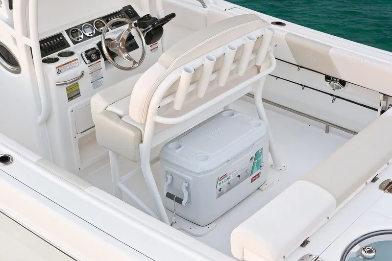 Slide: The Image of Manufacturer Provided Image: 2017 Robalo R242 Center Console boat interior with helm, seating, and cooler. - 9