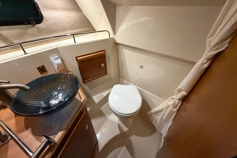 Slide: The Image of 2023 Ranger Tugs R-27 bathroom with modern sink and toilet. - 10