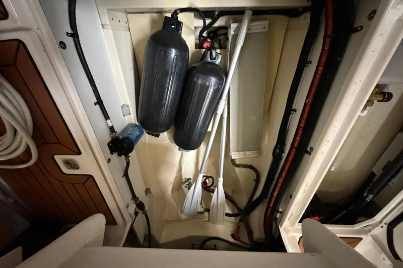 Slide: The Image of 2023 Ranger Tugs R-27 engine compartment with equipment and wiring. - 9