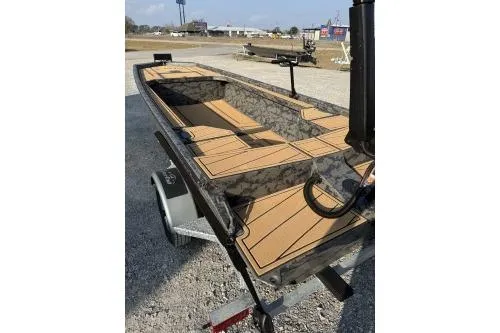 Slide: The Image of 2026 Gator Tail 1854 Extreme boat on trailer, featuring sleek design and spacious interior. - 11