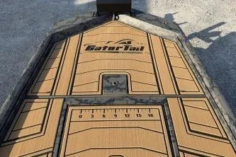 Slide: The Image of 2026 Gator Tail 1854 Extreme boat deck with ruler and logo design. - 4