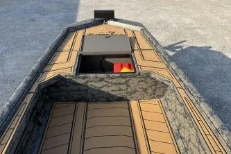 Slide: The Image of 2026 Gator Tail 1854 Extreme boat with open storage compartment, camo design, and tan flooring. - 5