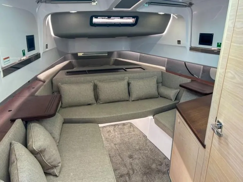 Slide: The Image of 2024 Axopar 45 XC Cross Cabin interior with modern seating and sleek design. - 24