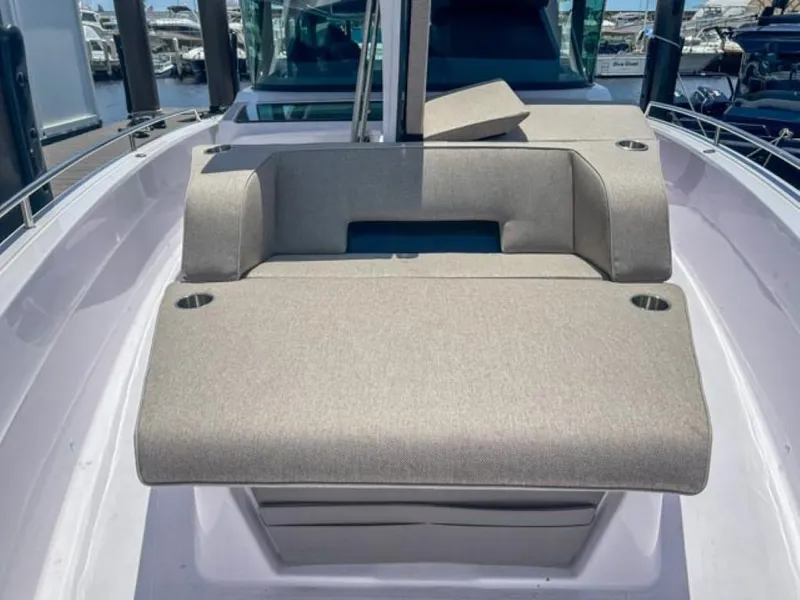 Slide: The Image of 2024 Axopar 45 XC Cross Cabin boat interior with cushioned seating. - 33