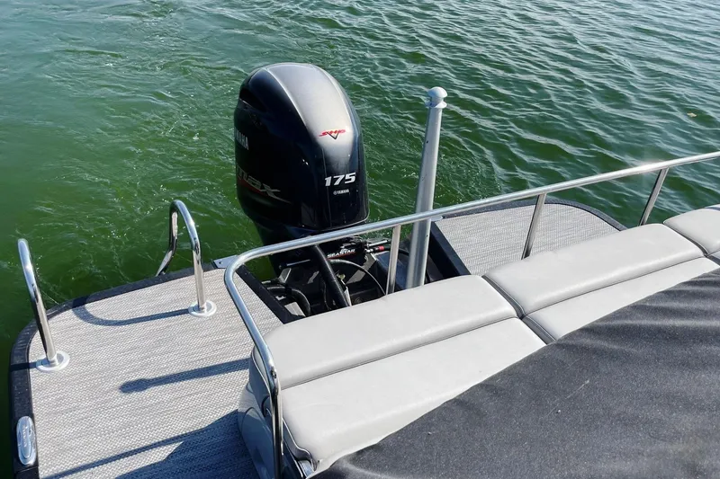 Slide: The Image of 2020 Bennington 22RSB pontoon boat with Yamaha 175 engine on calm water. - 11