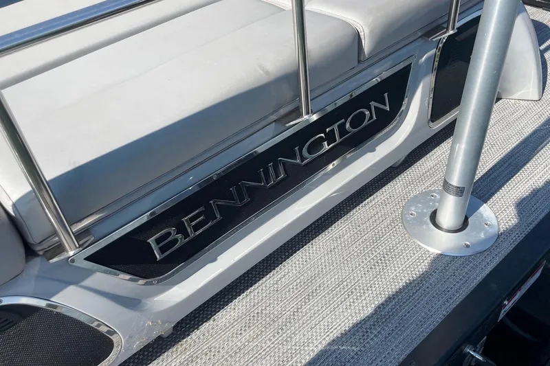 Slide: The Image of 2020 Bennington 22RSB boat interior with logo and seating area. - 13