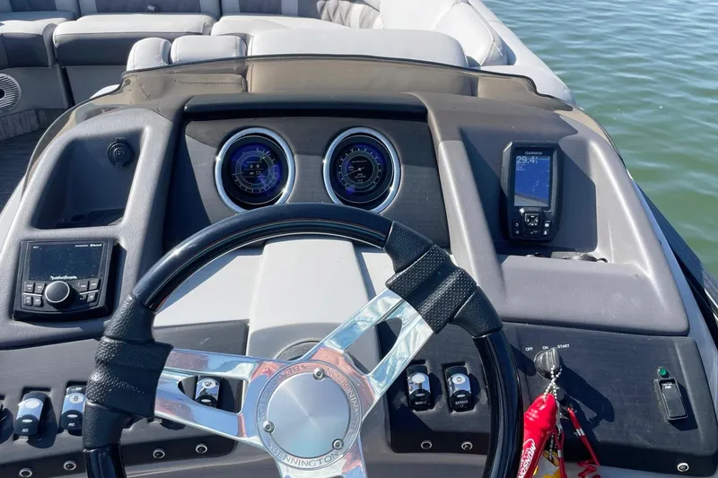 Slide: The Image of Steering console of 2020 Bennington 22RSB boat with gauges and navigation system. - 3