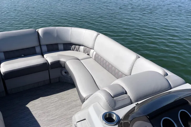 Slide: The Image of 2020 Bennington 22RSB pontoon boat with luxurious seating on calm water. - 5