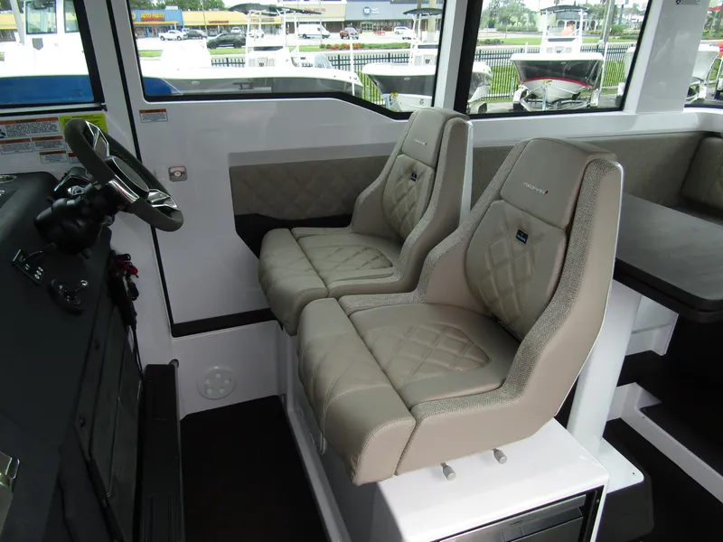 Slide: The Image of 2024 Axopar 37XC CROSS CABIN interior with luxurious seating and modern design. - 12