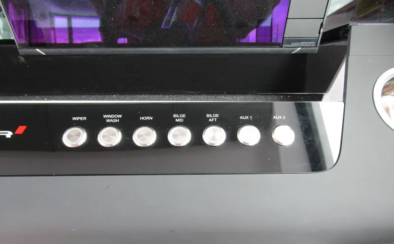 Slide: The Image of Control panel of 2024 Axopar 37XC CROSS CABIN with labeled buttons. - 19