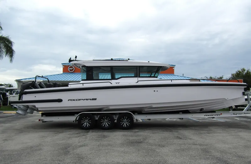 Slide: The Image of 2024 Axopar 37XC CROSS CABIN boat on trailer, side view. - 4