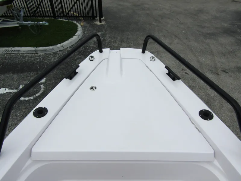 Slide: The Image of Bow view of 2024 Axopar 37XC CROSS CABIN, featuring sleek design and sturdy railings. - 7